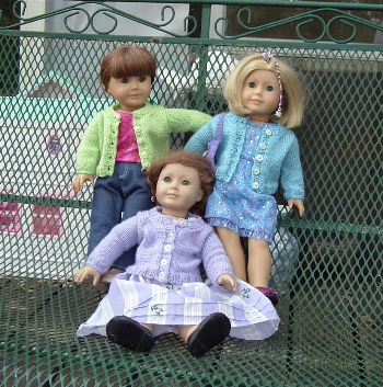 dolls in cardigans
