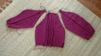 sweater pieces on the rug