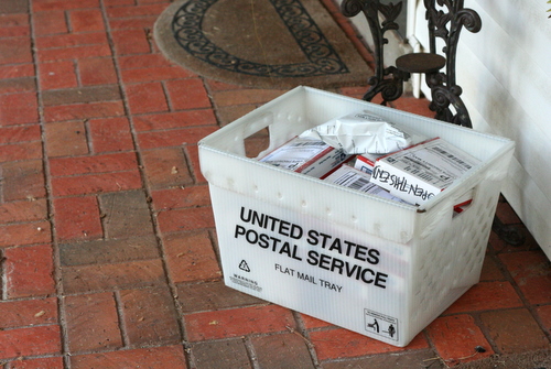boxes in a USPS tote