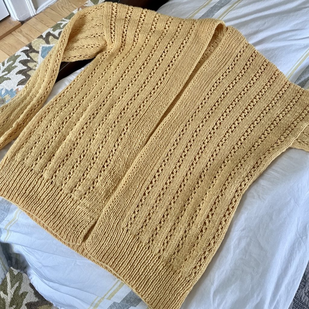 yellow cardigan with a lace pattern